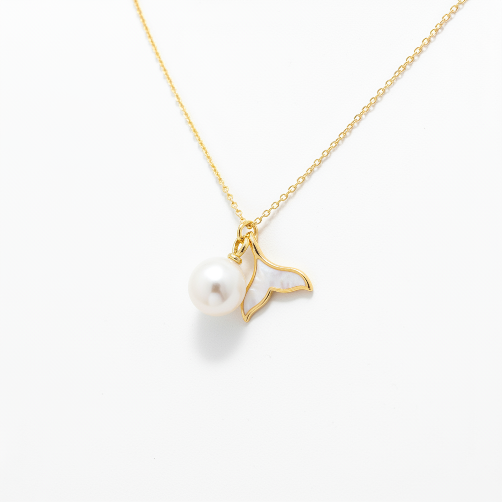 Pearl whale tail necklace solo product shot on white background