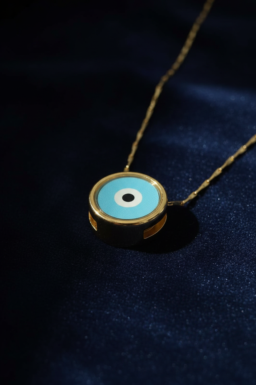 Turquoise evil eye gold necklace close-up on dark navy velvet luxury background
