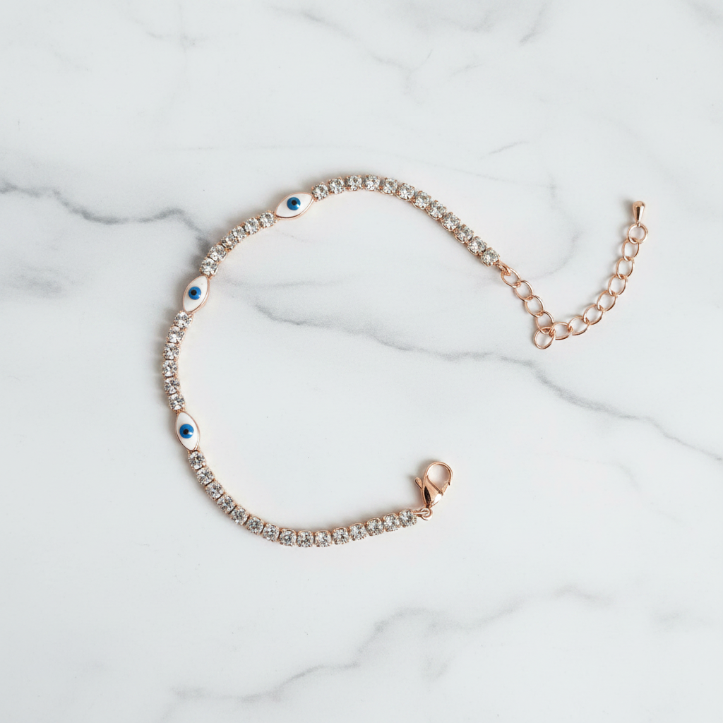 Evil eye tennis bracelet rose gold on white marble