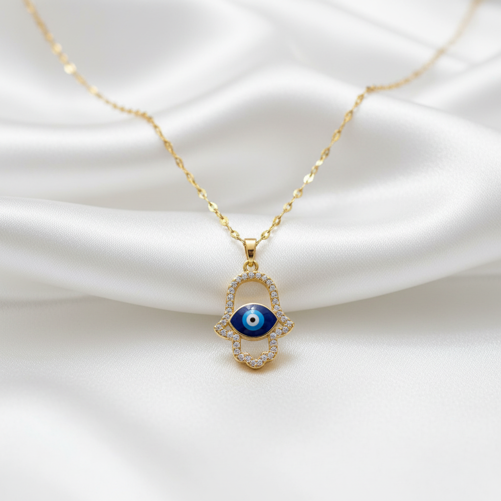 Hamsa evil eye pendant necklace on white silk