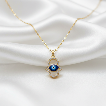 Hamsa evil eye pendant necklace on white silk