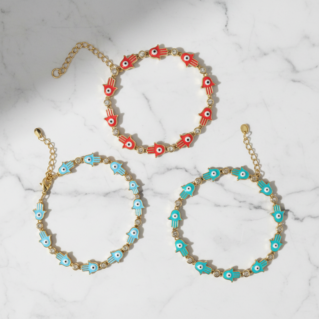 Three hamsa evil eye bracelets in red and turquoise on white background