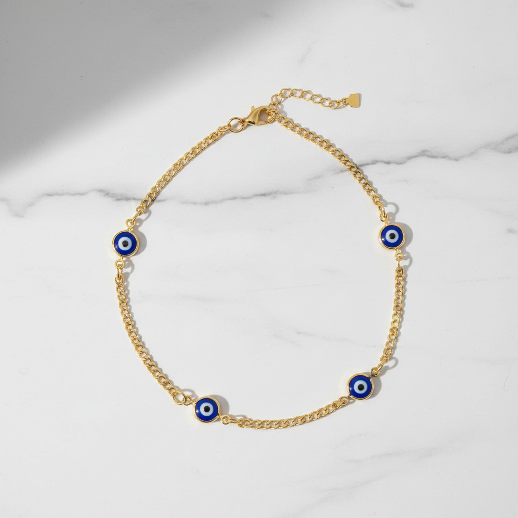 Multi evil eye anklet flat lay on marble