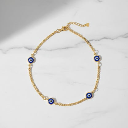 Multi evil eye anklet flat lay on marble