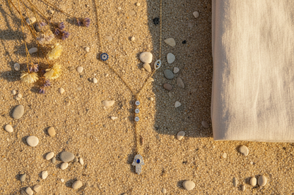 The Guardian Lariat lifestyle flat lay on sandy beach