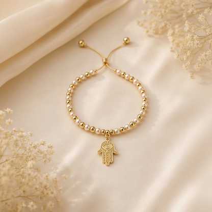 Pearl and gold hamsa bracelet on ivory silk with dried baby's breath flowers